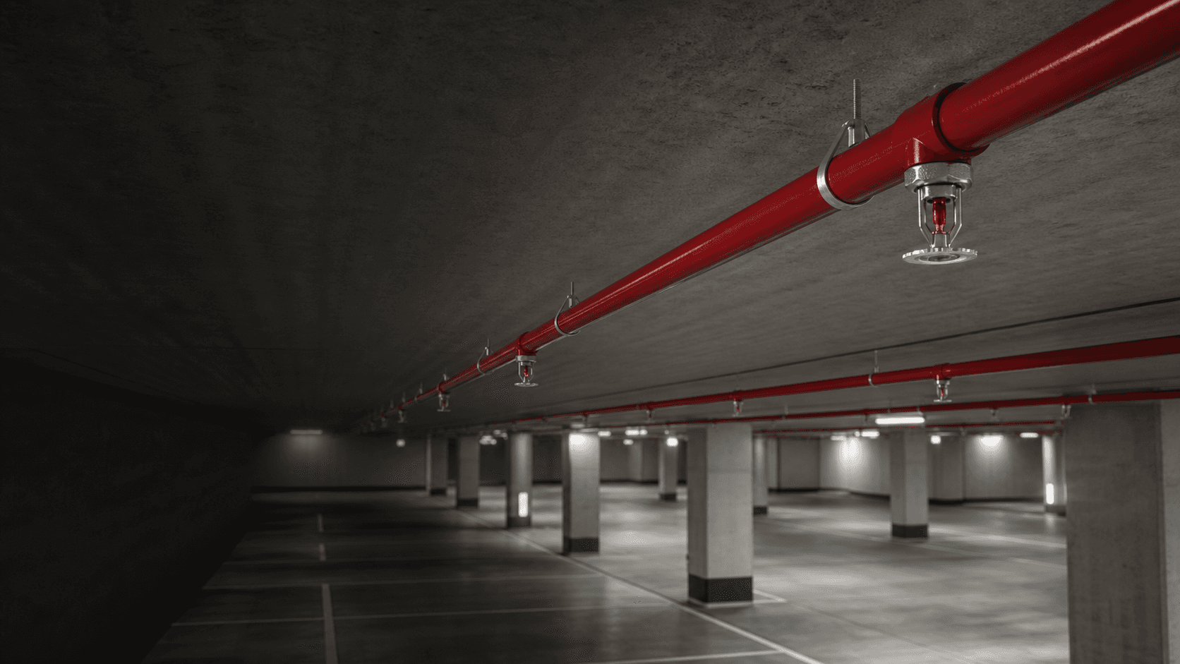 Red sprinkler pipework system in a parking facility